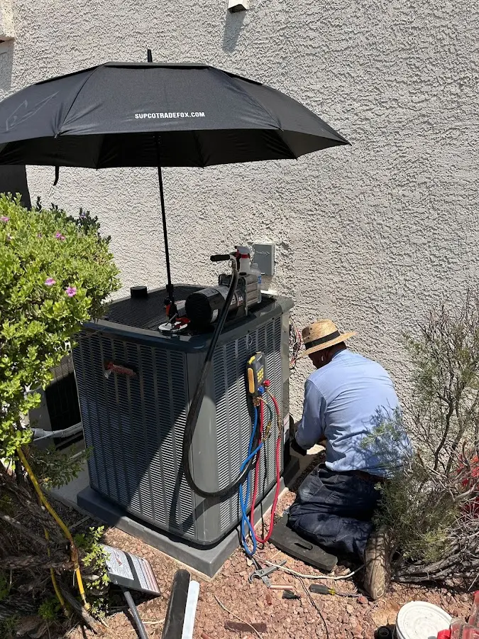 HVAC technician performing outdoor AC maintenance in Naperville